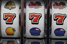 Slot machine reels showing lucky 7s